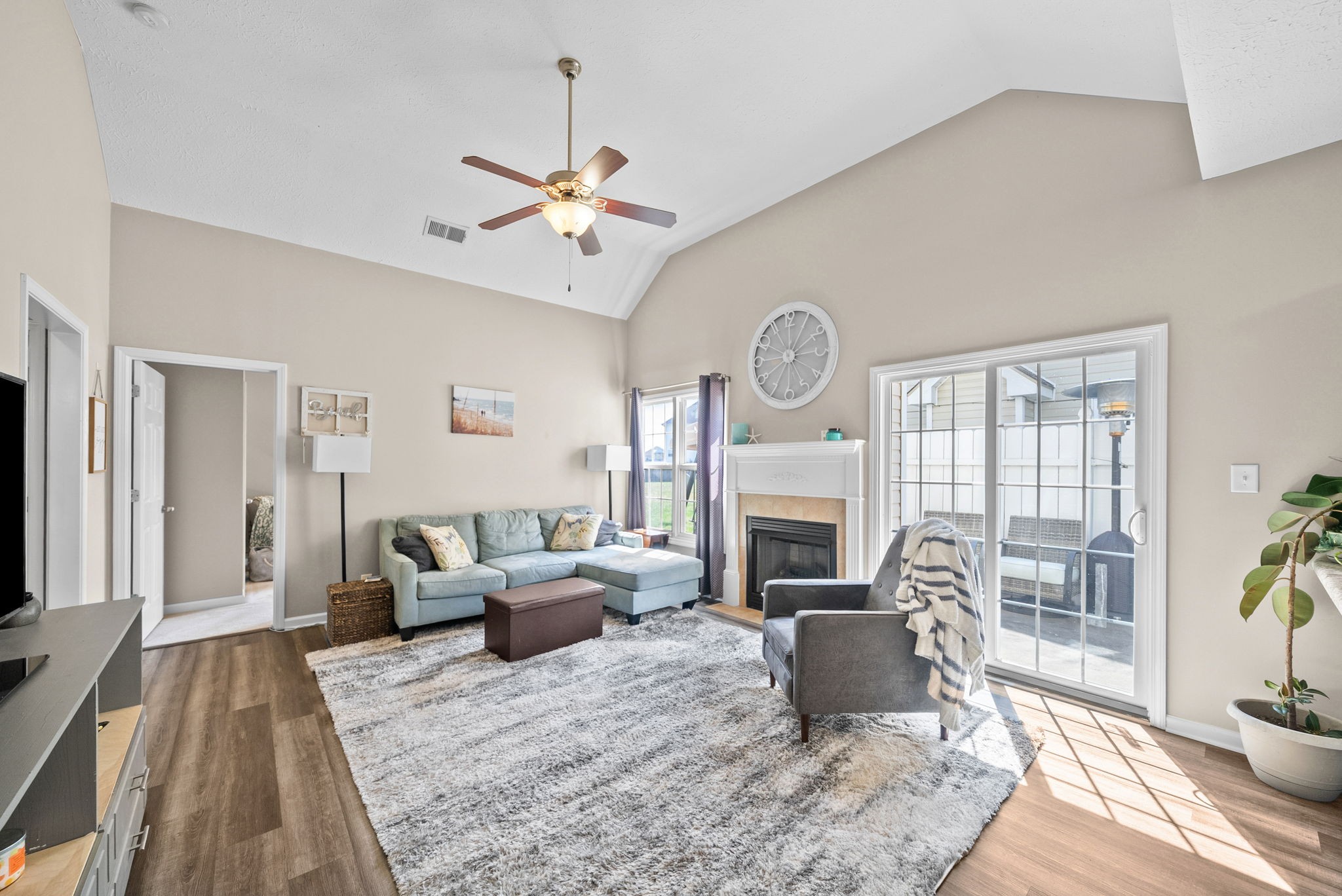 3737 Meadow Ridge Lane Clarksville, TN 37040 - Photo 9 of 32 a living room with furniture a fireplace and a flat screen tv