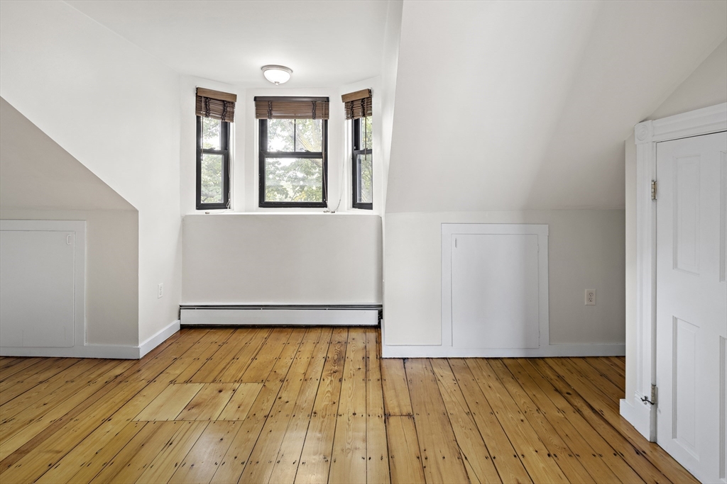 49 Worcester Street, Unit 4 Boston, MA 02118 - Photo 14 of 19 a view of empty room with wooden floor and fan