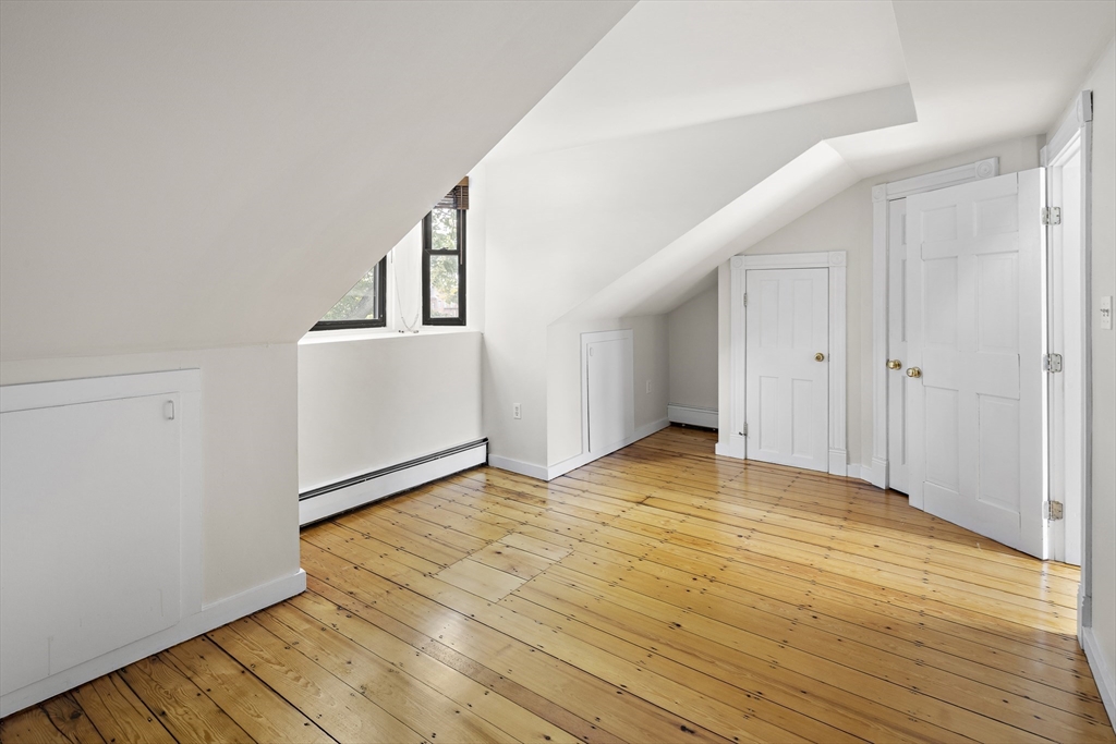 49 Worcester Street, Unit 4 Boston, MA 02118 - Photo 15 of 19 a view of empty room with wooden floor