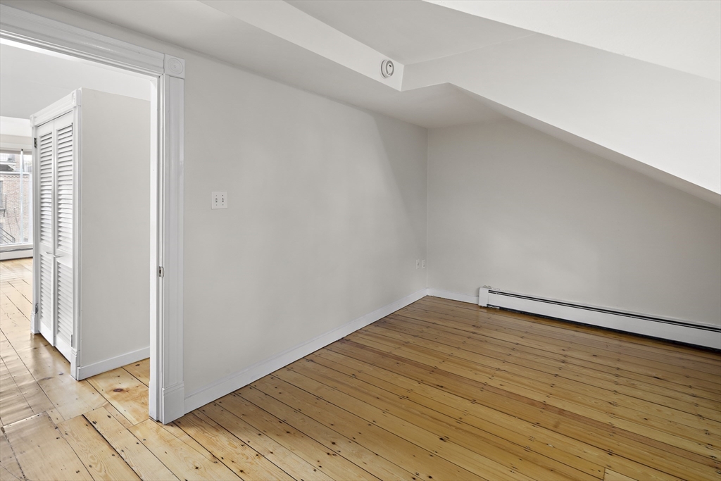 49 Worcester Street, Unit 4 Boston, MA 02118 - Photo 17 of 19 a view of empty room with wooden floor