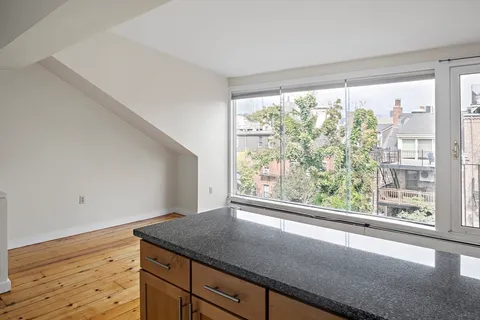 a view of a room that has a window in it
