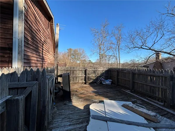 a view of a roof deck with wooden floor