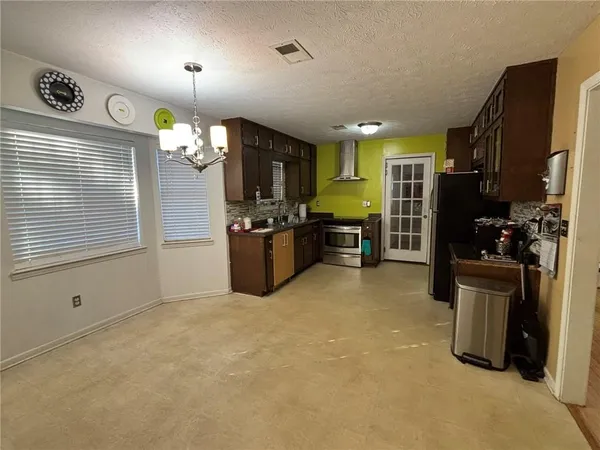 a view of a kitchen with furniture and a window