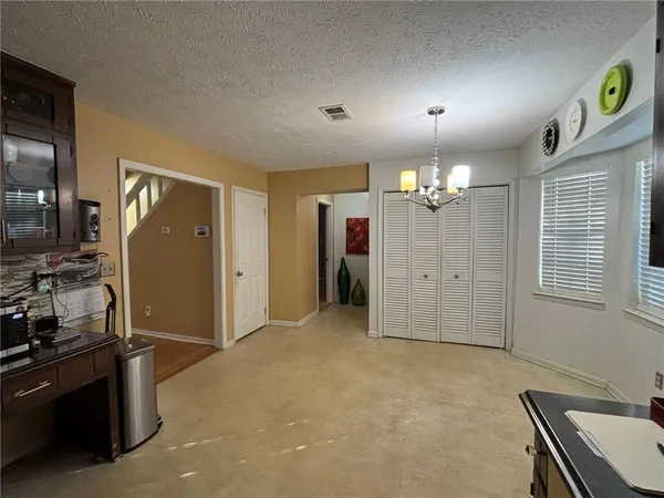 a view of a livingroom with a workspace