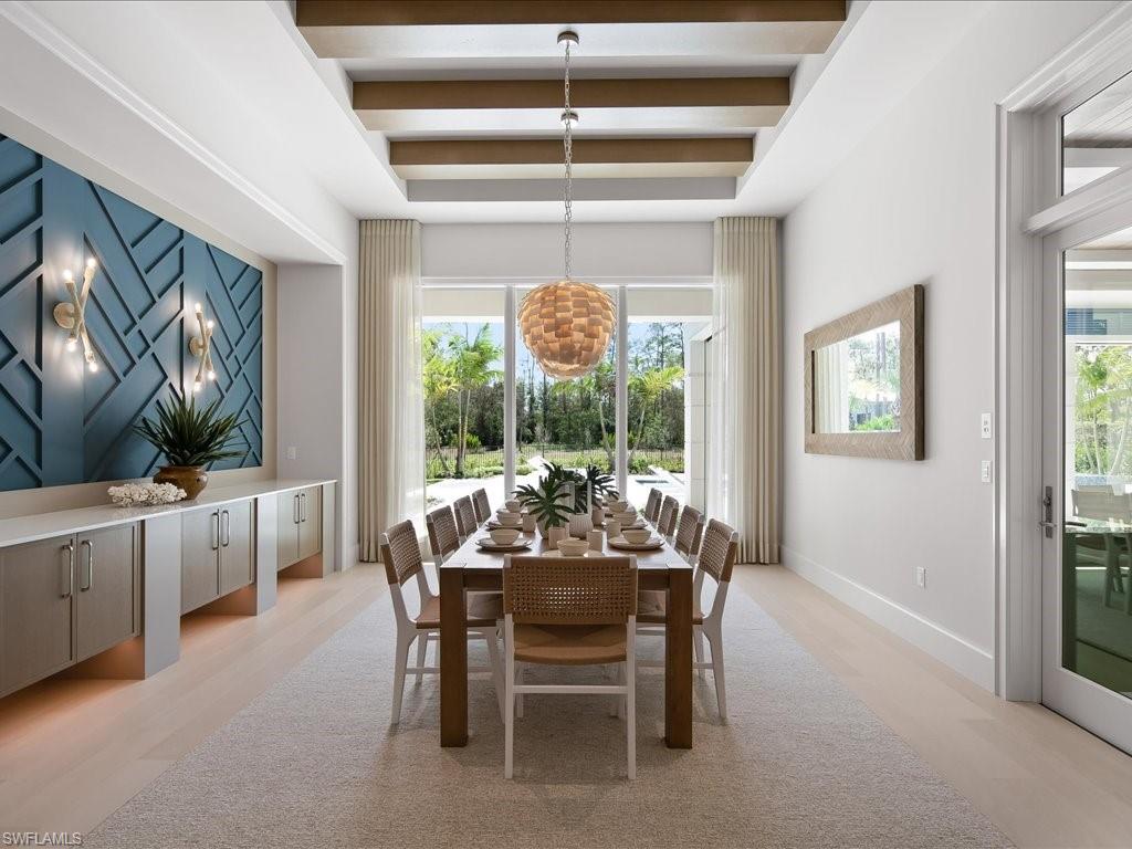 6730 Sable Ridge Lane Naples, FL 34109 - Photo 13 of 50 a dining room with furniture and window