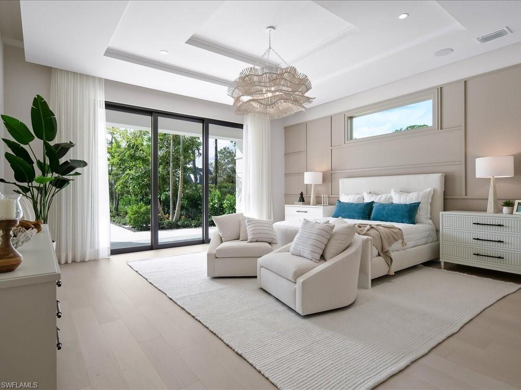 6730 Sable Ridge Lane Naples, FL 34109 - Photo 15 of 50 a living room with furniture and a large window