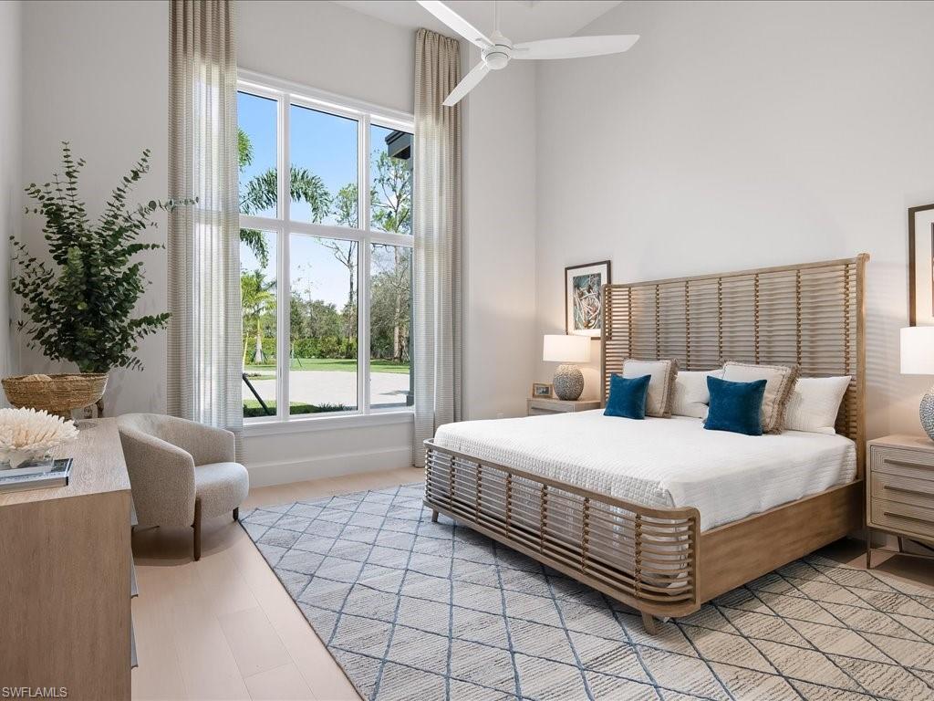 6730 Sable Ridge Lane Naples, FL 34109 - Photo 25 of 50 a bedroom with a large bed and a window