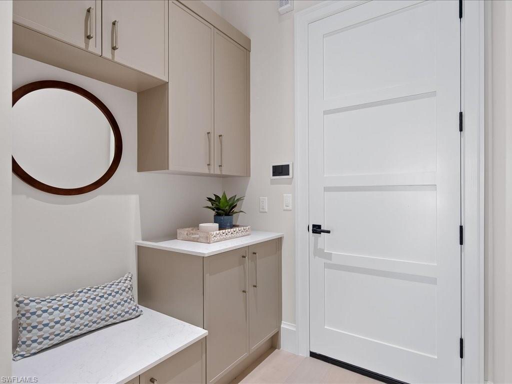 6730 Sable Ridge Lane Naples, FL 34109 - Photo 31 of 50 a bathroom with a sink a toilet and a mirror