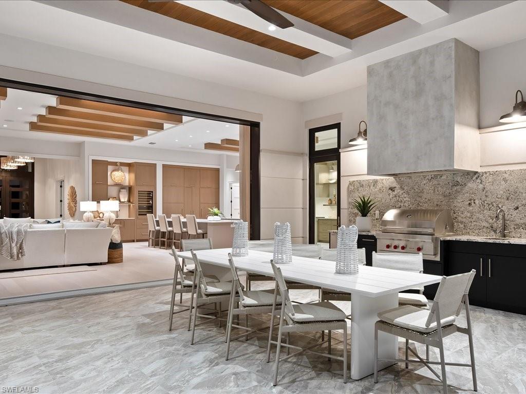 6730 Sable Ridge Lane Naples, FL 34109 - Photo 32 of 50 a dining room with furniture and window