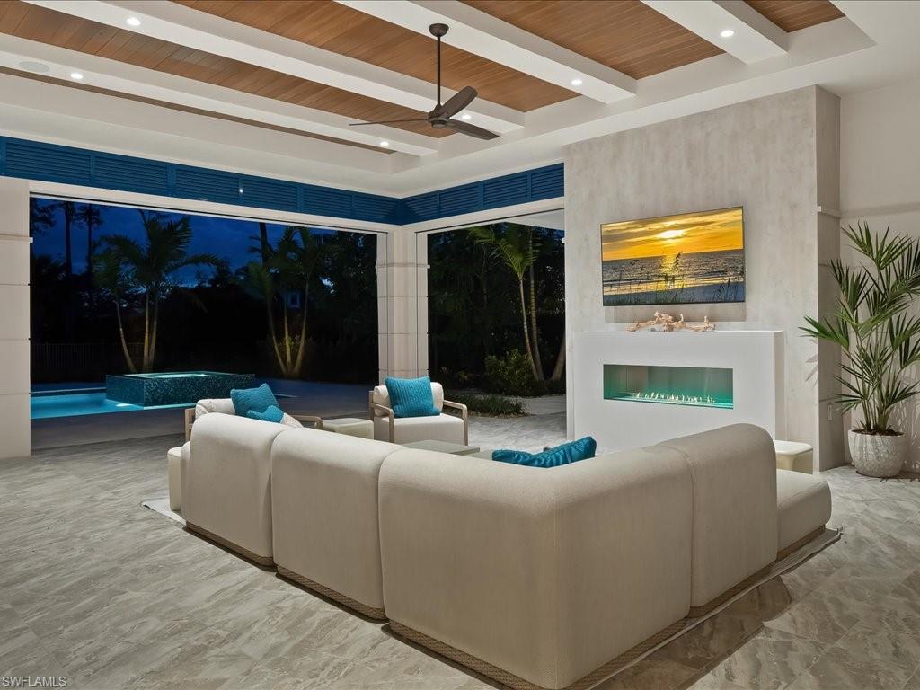 6730 Sable Ridge Lane Naples, FL 34109 - Photo 36 of 50 a living room with furniture and a potted plant