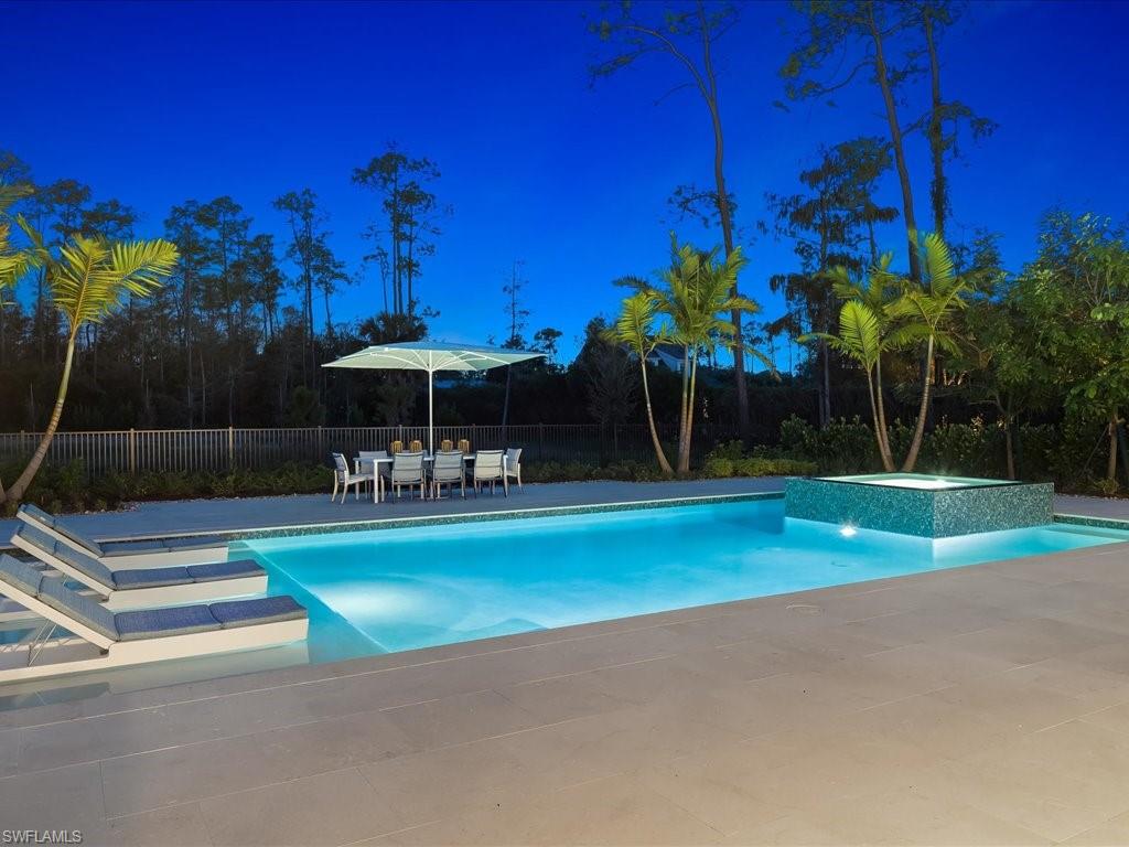 6730 Sable Ridge Lane Naples, FL 34109 - Photo 37 of 50 a view of a fountain in front of a house