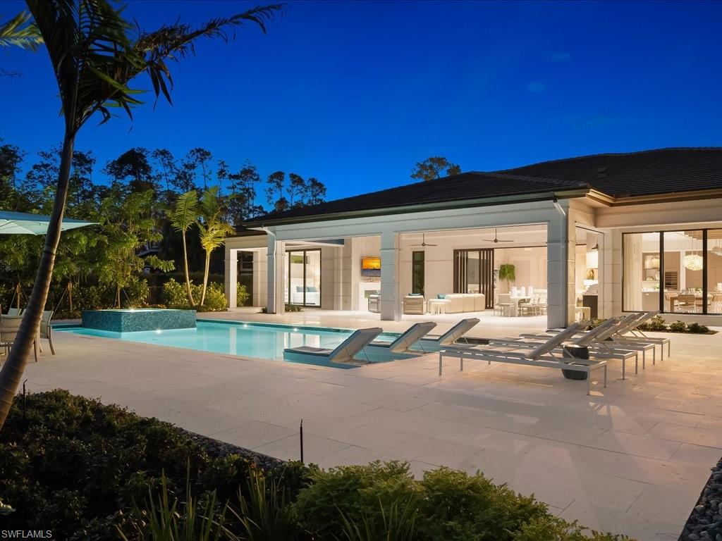 6730 Sable Ridge Lane Naples, FL 34109 - Photo 39 of 50 a house view with outdoor seating space