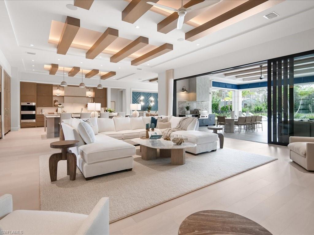 6730 Sable Ridge Lane Naples, FL 34109 - Photo 4 of 50 a living room with furniture and a large window