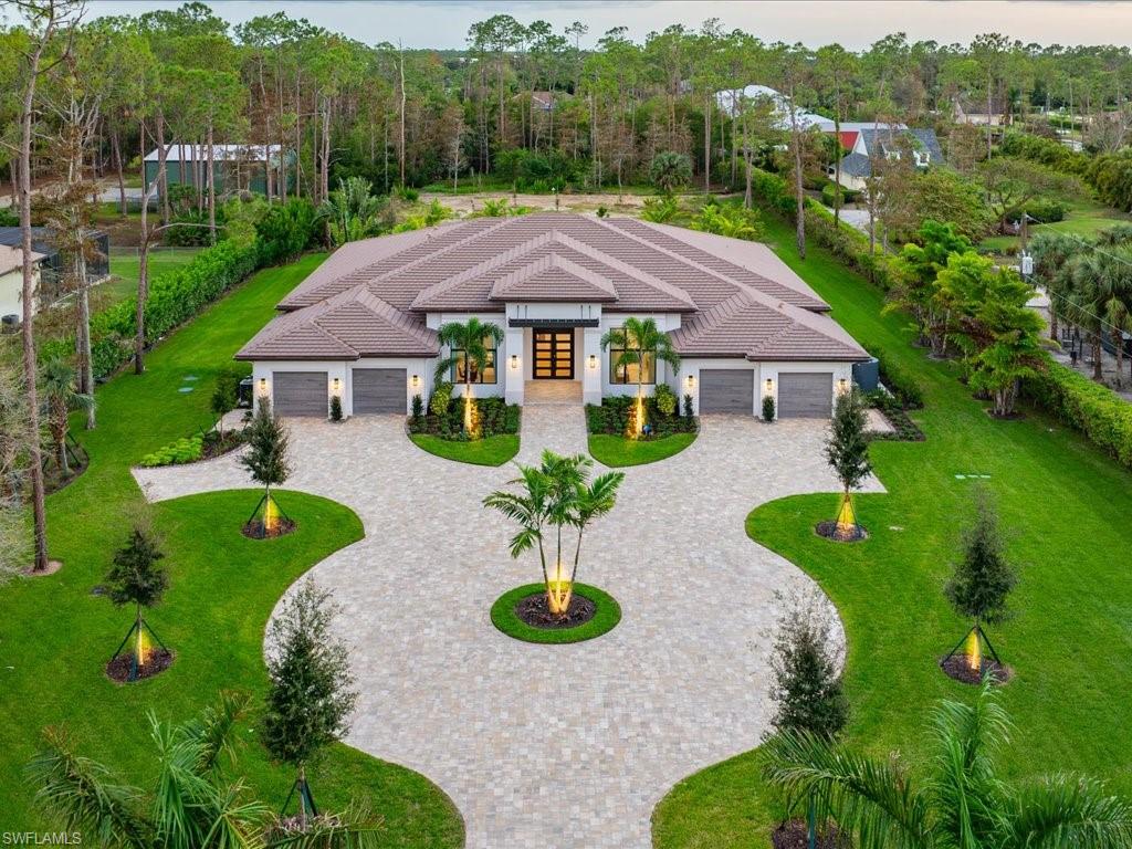 6730 Sable Ridge Lane Naples, FL 34109 - Photo 43 of 50 an aerial view of a house with garden space and street view