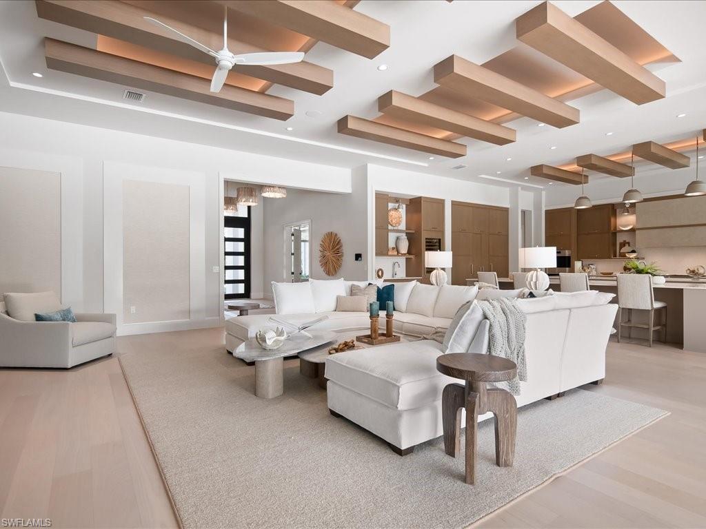 6730 Sable Ridge Lane Naples, FL 34109 - Photo 5 of 50 a living room with furniture and a large window