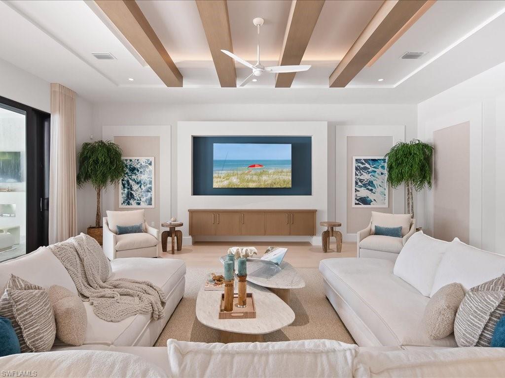 6730 Sable Ridge Lane Naples, FL 34109 - Photo 6 of 50 a living room with furniture and a large window