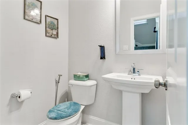 a view of hall way with furniture and staircase