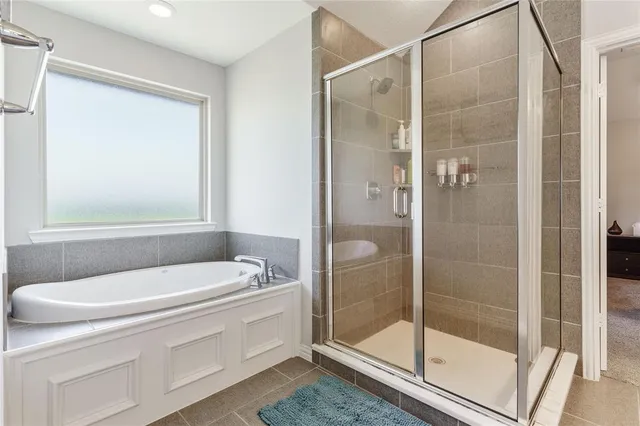 a bedroom with a bed and a bookshelf