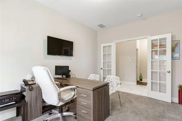 a bedroom with a bed and a table