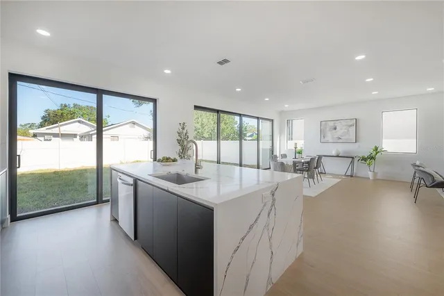 a kitchen with a sink and cabinets