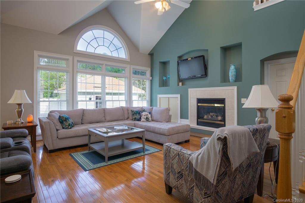3236 Colonel Springs Way Fort Mill, SC 29708 - Photo 12 of 45 a living room with furniture large window and a fireplace