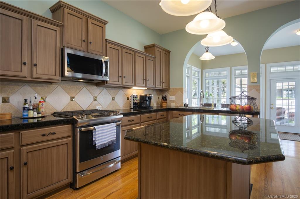 3236 Colonel Springs Way Fort Mill, SC 29708 - Photo 17 of 45 a kitchen with stainless steel appliances granite countertop a sink a stove and cabinets