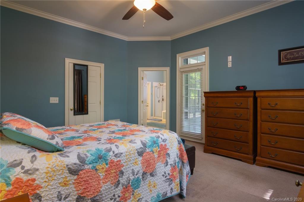 3236 Colonel Springs Way Fort Mill, SC 29708 - Photo 23 of 45 a bedroom with a bed and a dresser