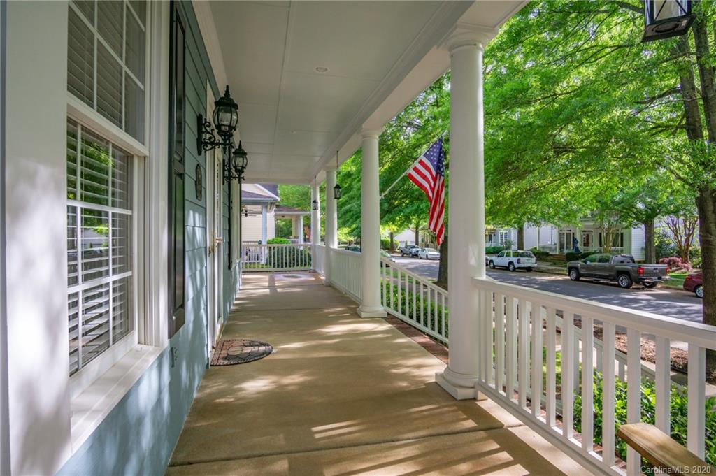 3236 Colonel Springs Way Fort Mill, SC 29708 - Photo 6 of 45 a view of a street with large trees and wooden fence