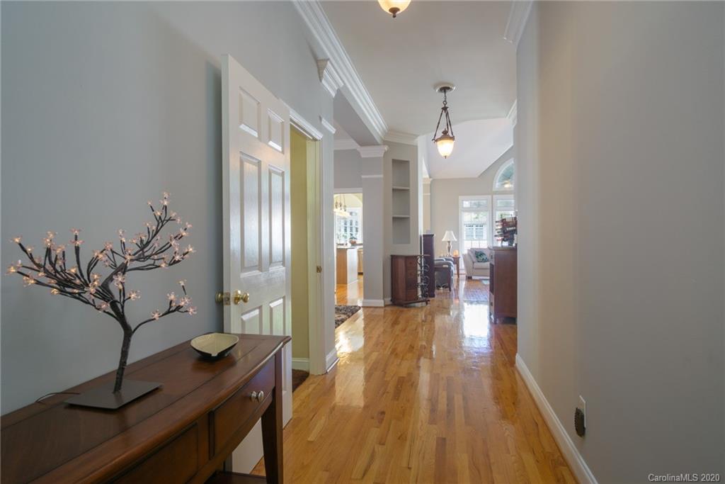 3236 Colonel Springs Way Fort Mill, SC 29708 - Photo 8 of 45 a view of a hallway view with wooden floor and staircase