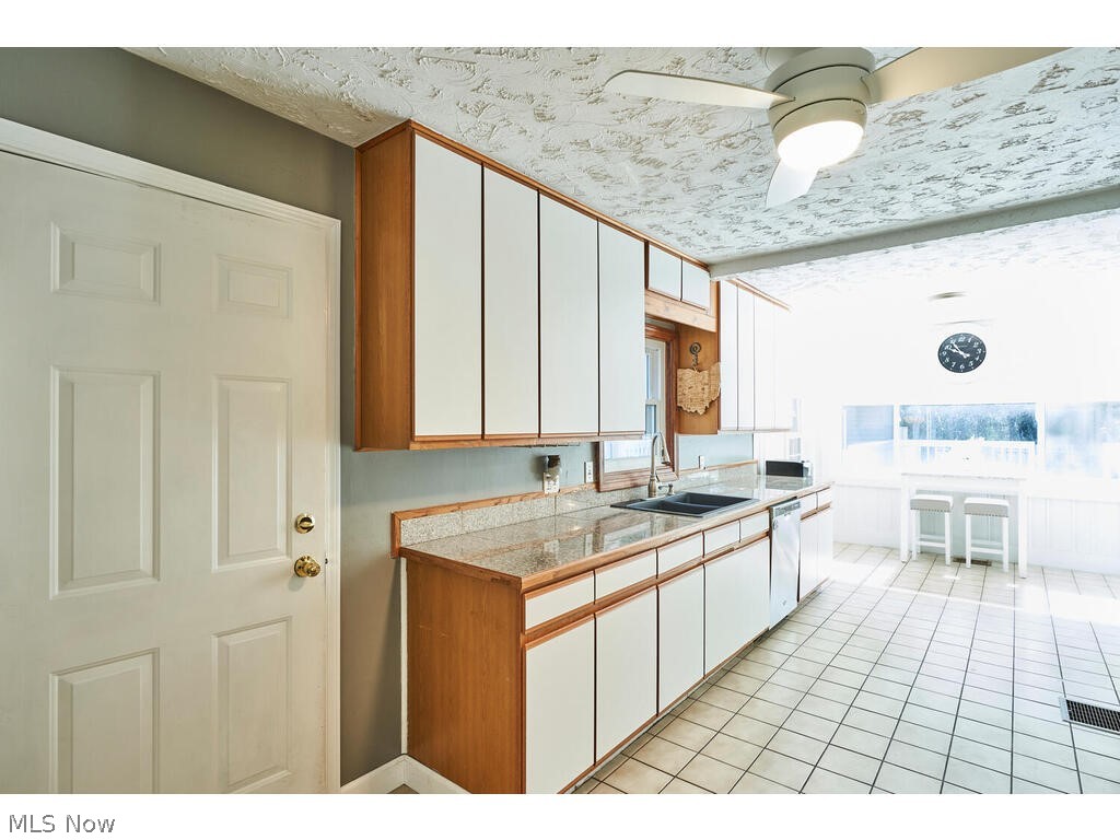837 Brunsdorph Road Fairlawn, OH 44333 - Photo 9 of 35 Nice size kitchen with white european cabinets and tiled floor