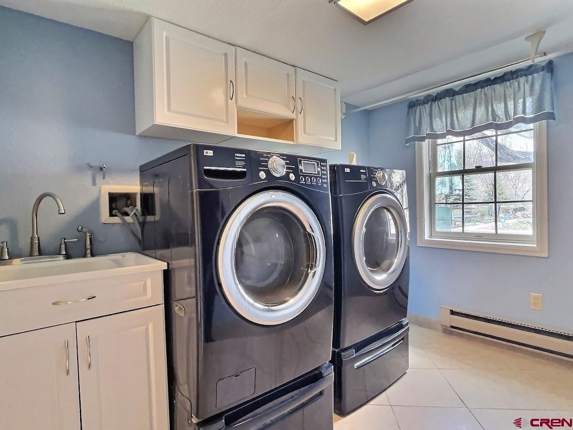 21007 Marion Road Eckert, CO 81418 - Photo 13 of 35 a utility room with dryer and washer