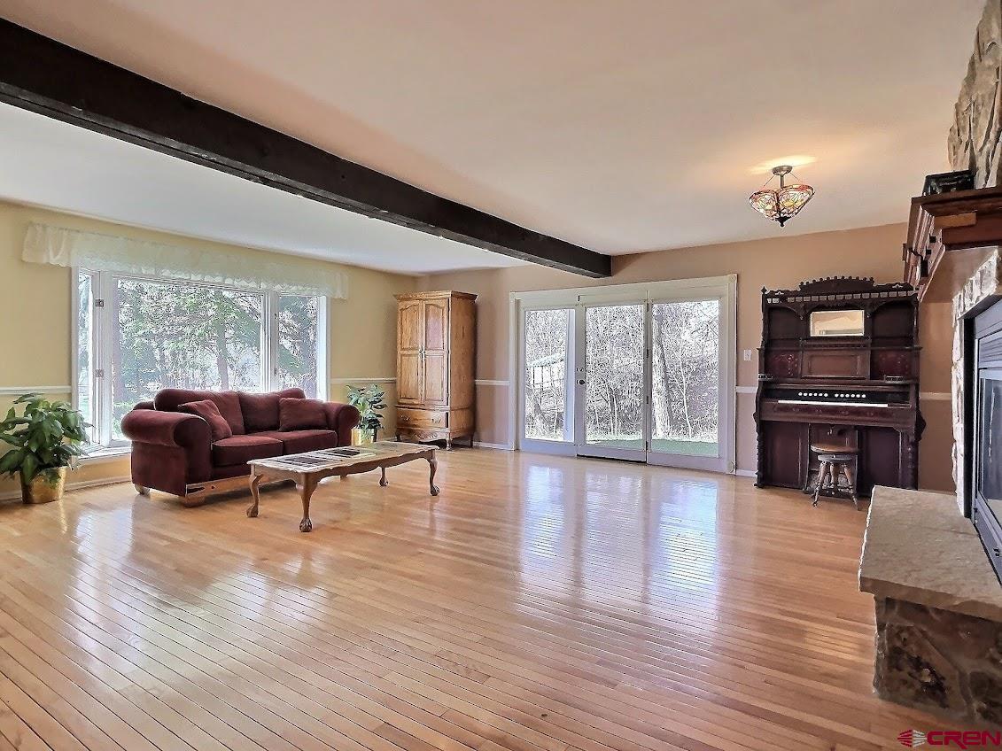 21007 Marion Road Eckert, CO 81418 - Photo 3 of 35 a living room with furniture and a flat screen tv