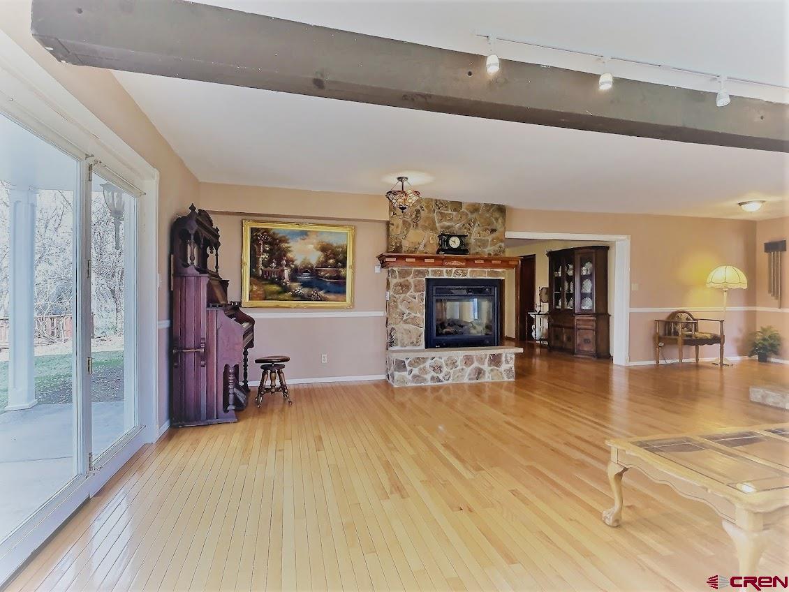 21007 Marion Road Eckert, CO 81418 - Photo 4 of 35 a view of a livingroom with furniture flat screen tv and staircase