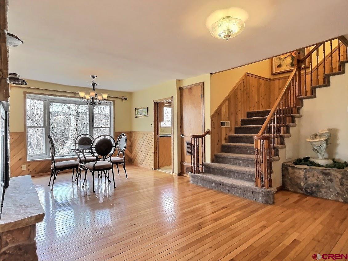 21007 Marion Road Eckert, CO 81418 - Photo 6 of 35 a dining room with furniture and wooden floor