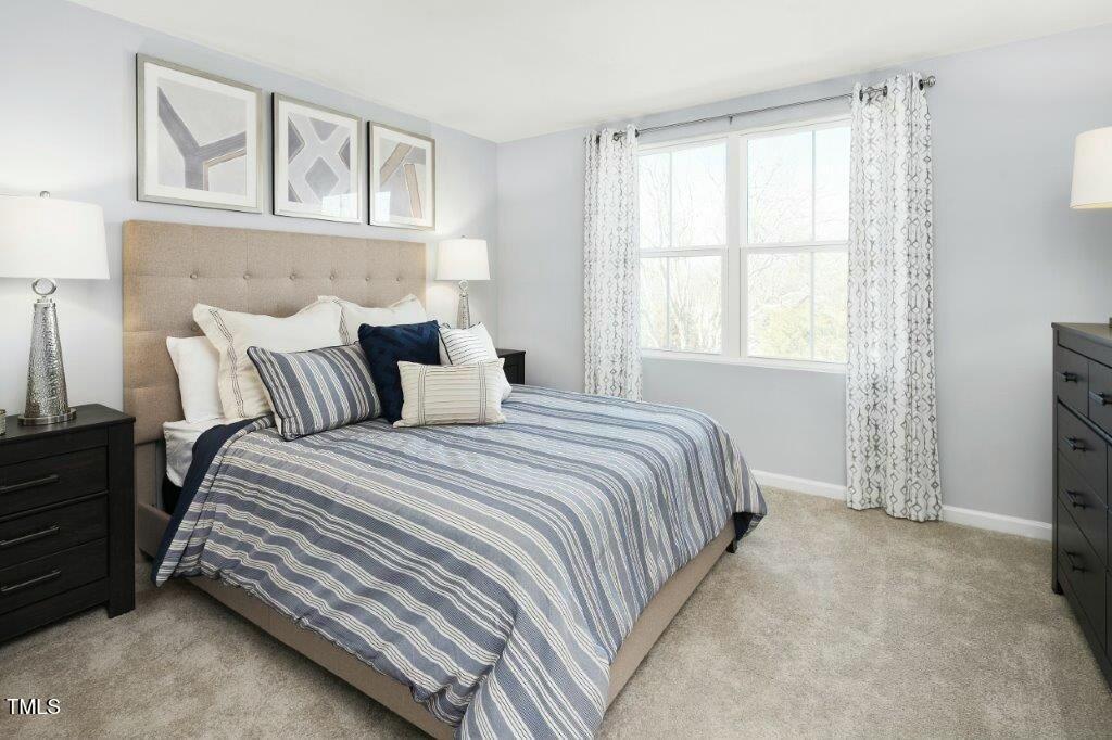 125 Sunny Acrs Road Raleigh, NC 27603 - Photo 11 of 19 a bedroom with a bed and a window
