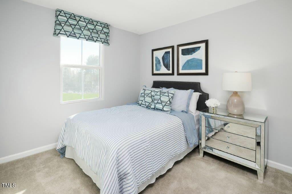125 Sunny Acrs Road Raleigh, NC 27603 - Photo 16 of 19 a bedroom with a bed and a window