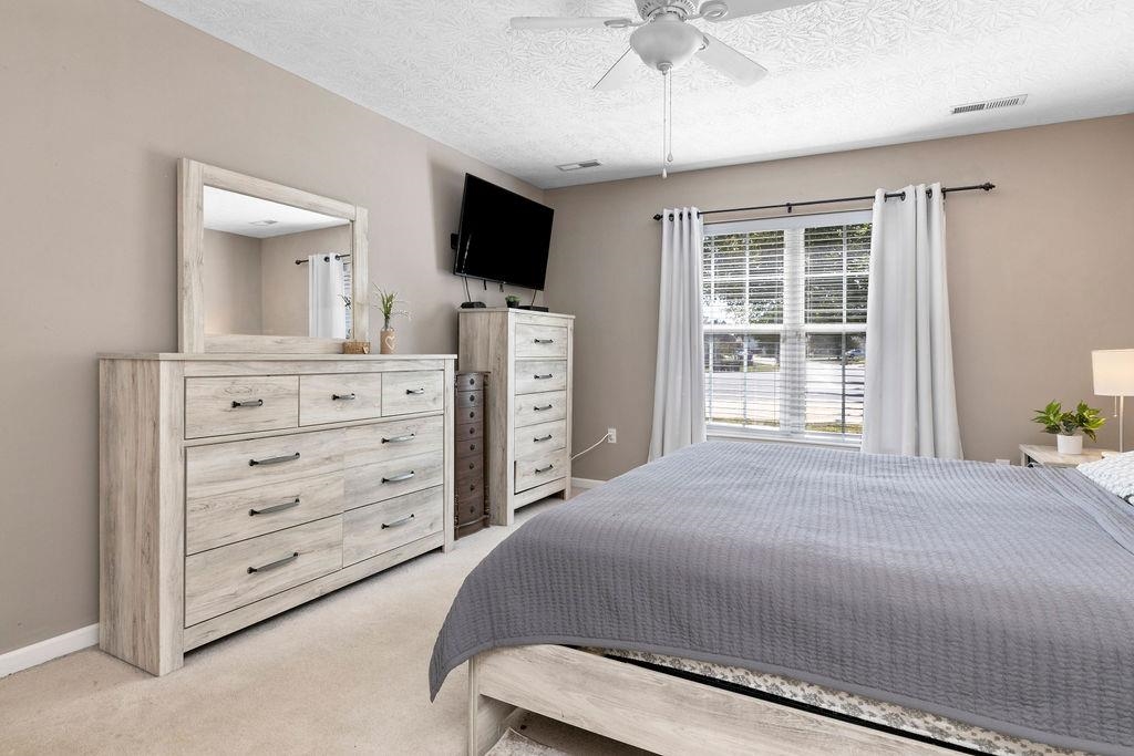 224 Inglecress Road Waynesboro, VA 22980 - Photo 16 of 42 a bedroom with a bed dresser and a flat screen tv