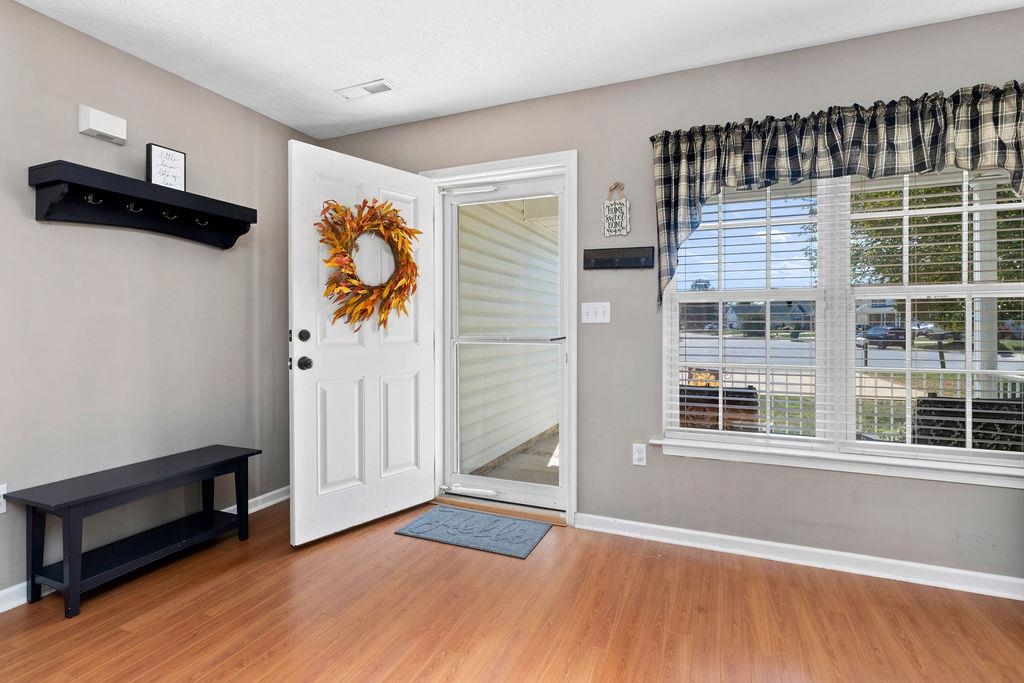 224 Inglecress Road Waynesboro, VA 22980 - Photo 2 of 42 a view of an empty room with a window and wooden floor