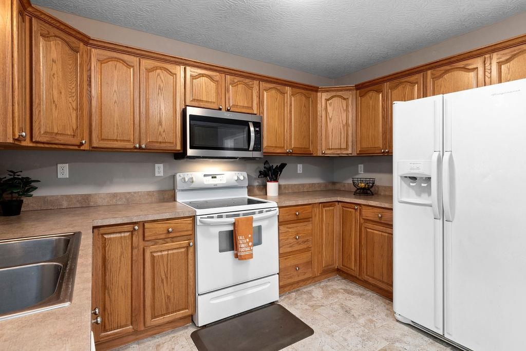 224 Inglecress Road Waynesboro, VA 22980 - Photo 8 of 42 a kitchen with a refrigerator stove and microwave