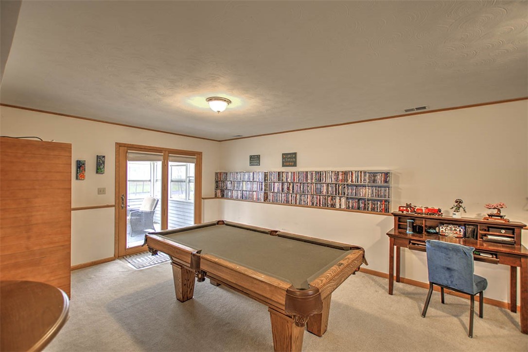 4081 Sheffield Court Decatur, IL 62526 - Photo 18 of 29 a living room with a couch and a table