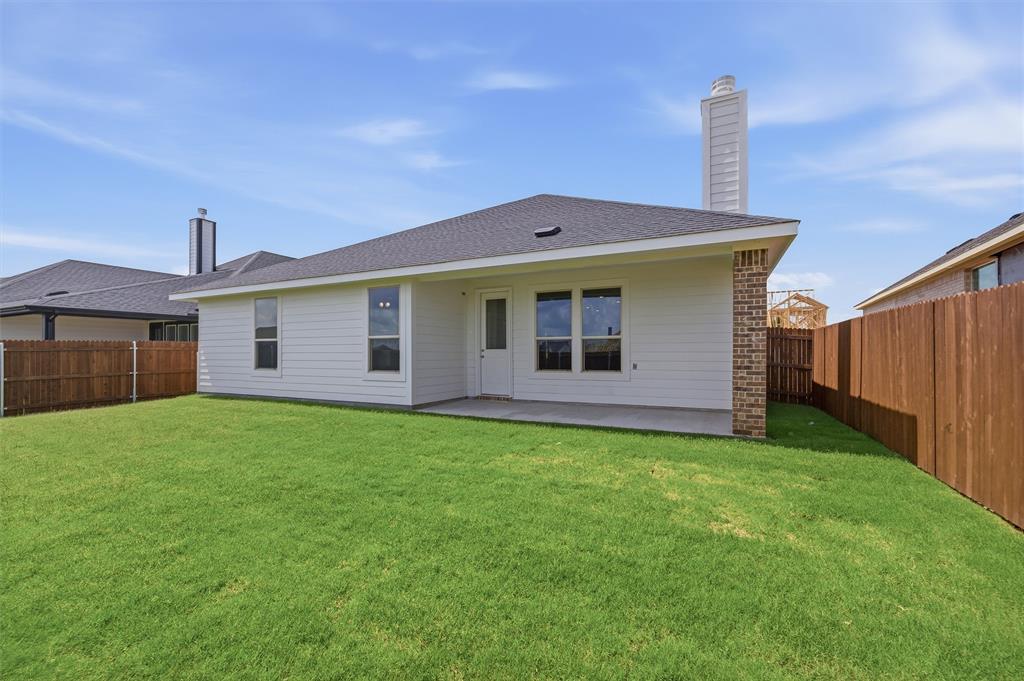 1209 Colca Drive Springtown, TX 76082 - Photo 21 of 24 Expansive green lawn surrounds the rear of the property