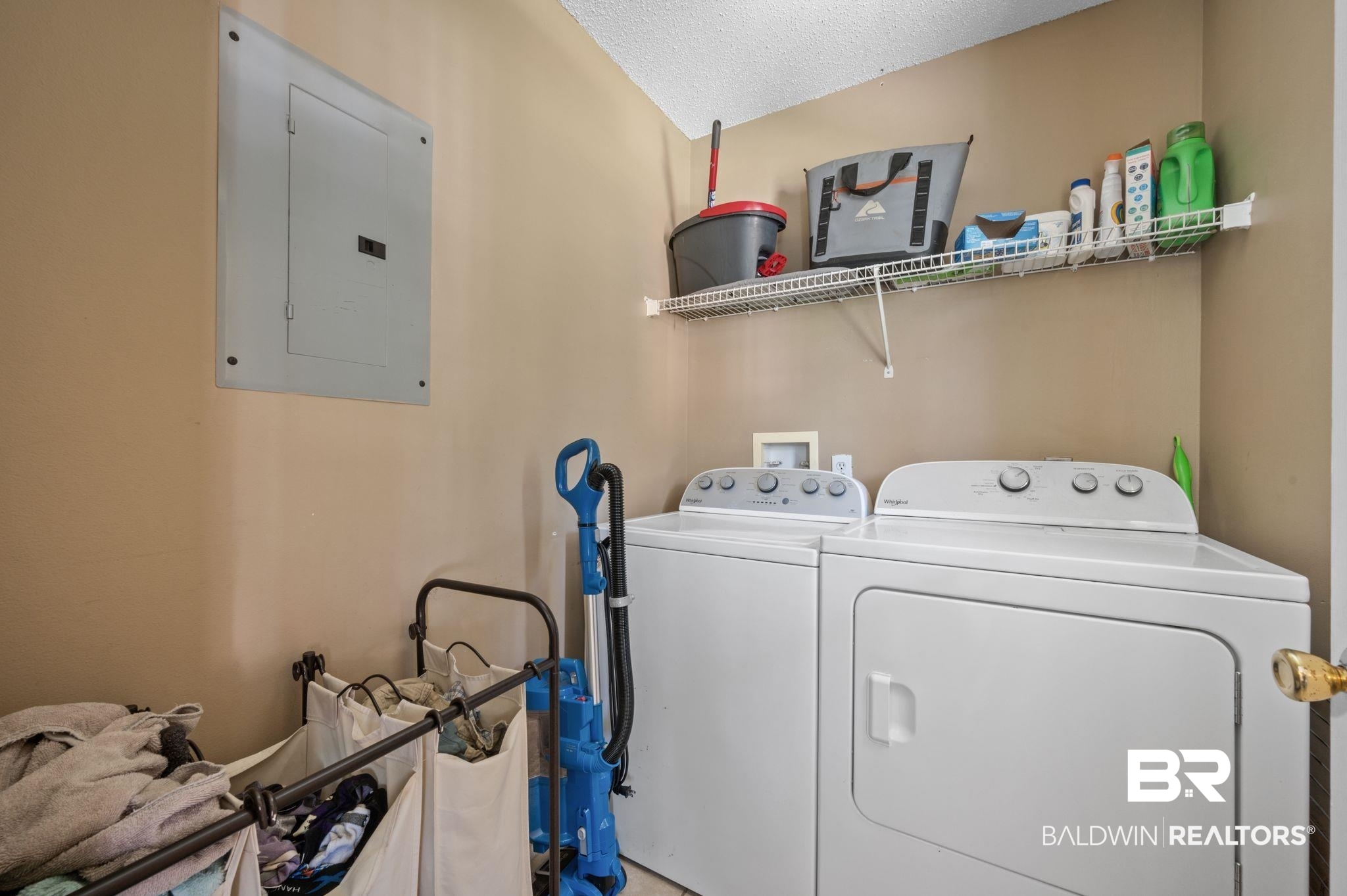 13025 County Road 55 Foley, AL 36535 - Photo 13 of 49 Washroom with electric panel, a textured ceiling, and washing machine and dryer