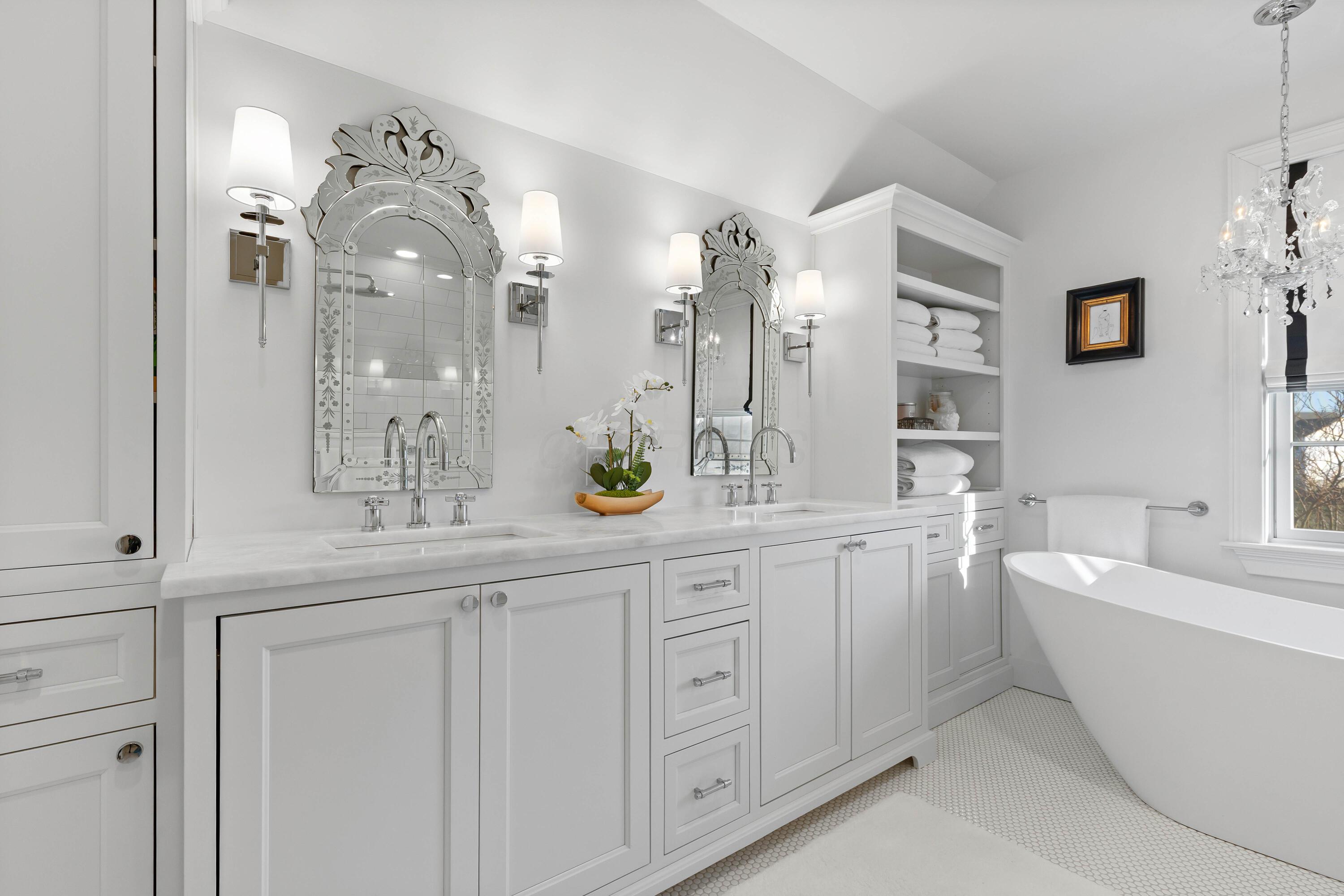1364 Dale Ford Road Delaware, OH 43015 - Photo 52 of 112 • Ceramic tile flooring • White painted walls • Custom built enclosed vanity with double bowl, marble sinktop • Lighted wall sconces • Bubble jetted garden tub • Linen storage • Chandelier • Can lighting • (2) shower stations with rainhead & wands with ceramic tile surround • (1) extra rainhead in center with ceramic tile surround • Pocket door • Mirrors are negotiable