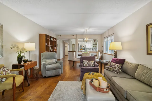 a living room with furniture or couch and a lamp