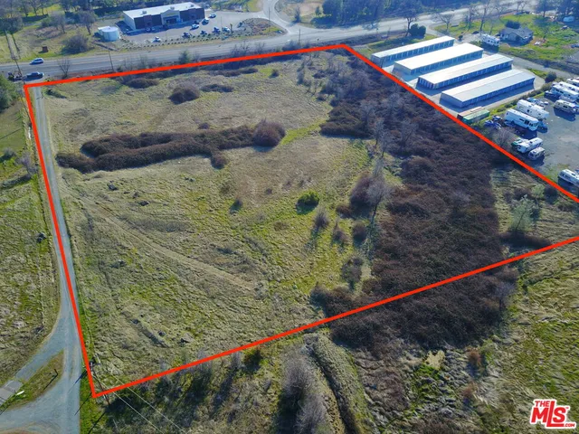 a view of water pool with a small yard