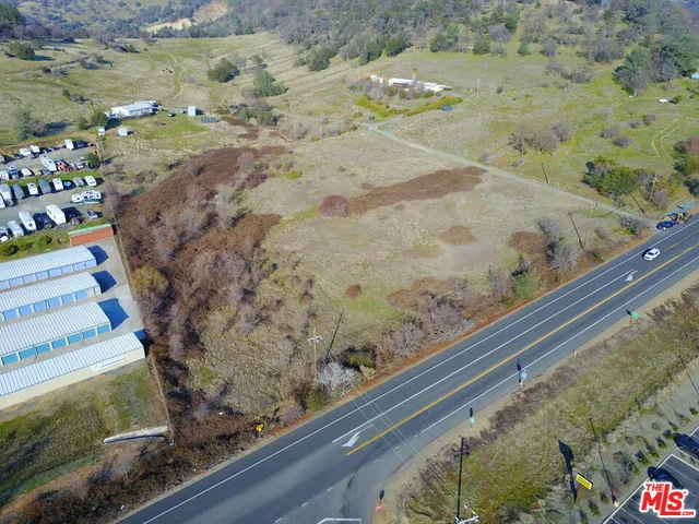 a view of mountains with wooden floor