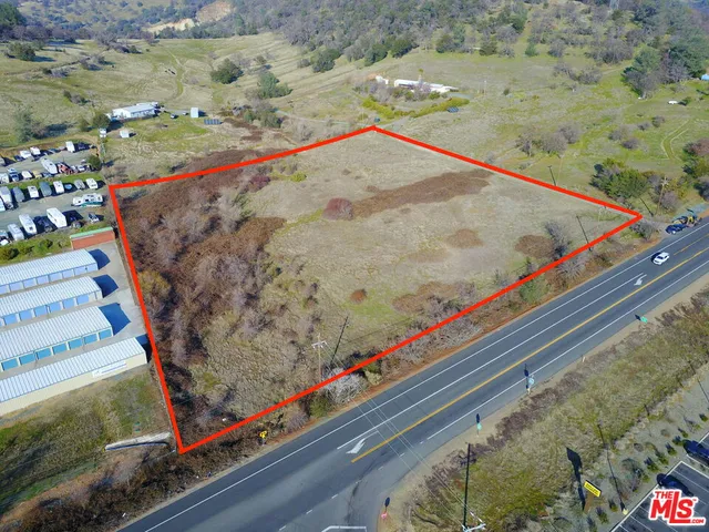 a wooden floor with view of swimming pool