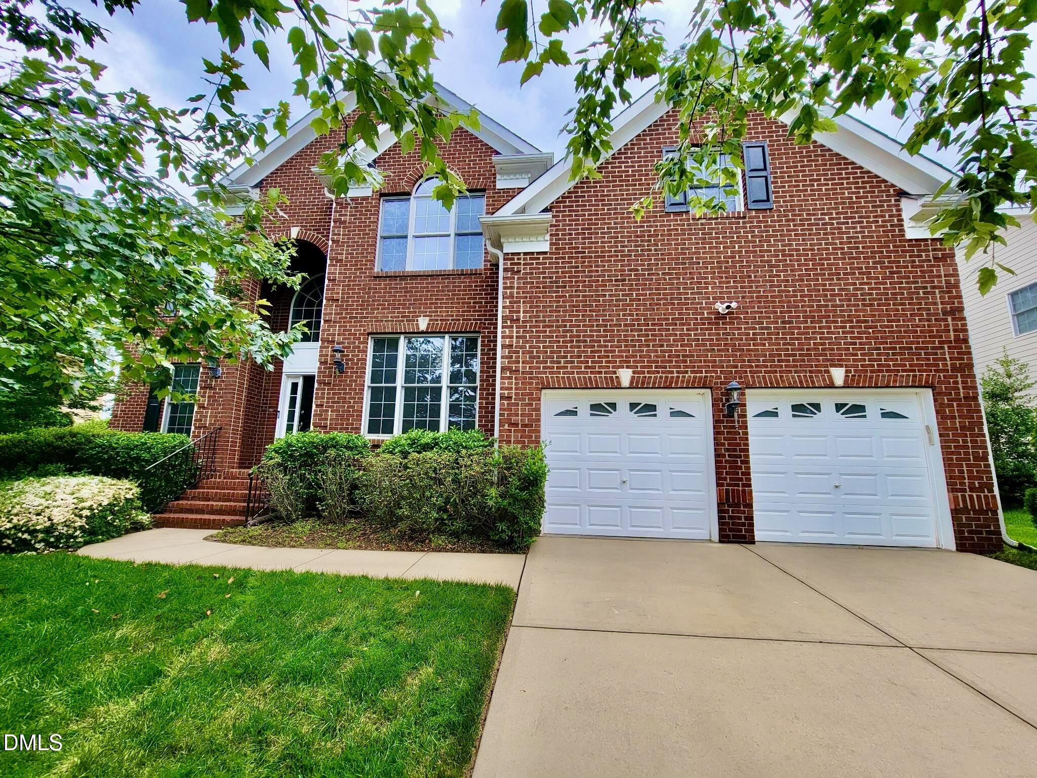 9441 Collingdale Way Raleigh, NC 27617 - Photo 1 of 54 front view of house with a yard