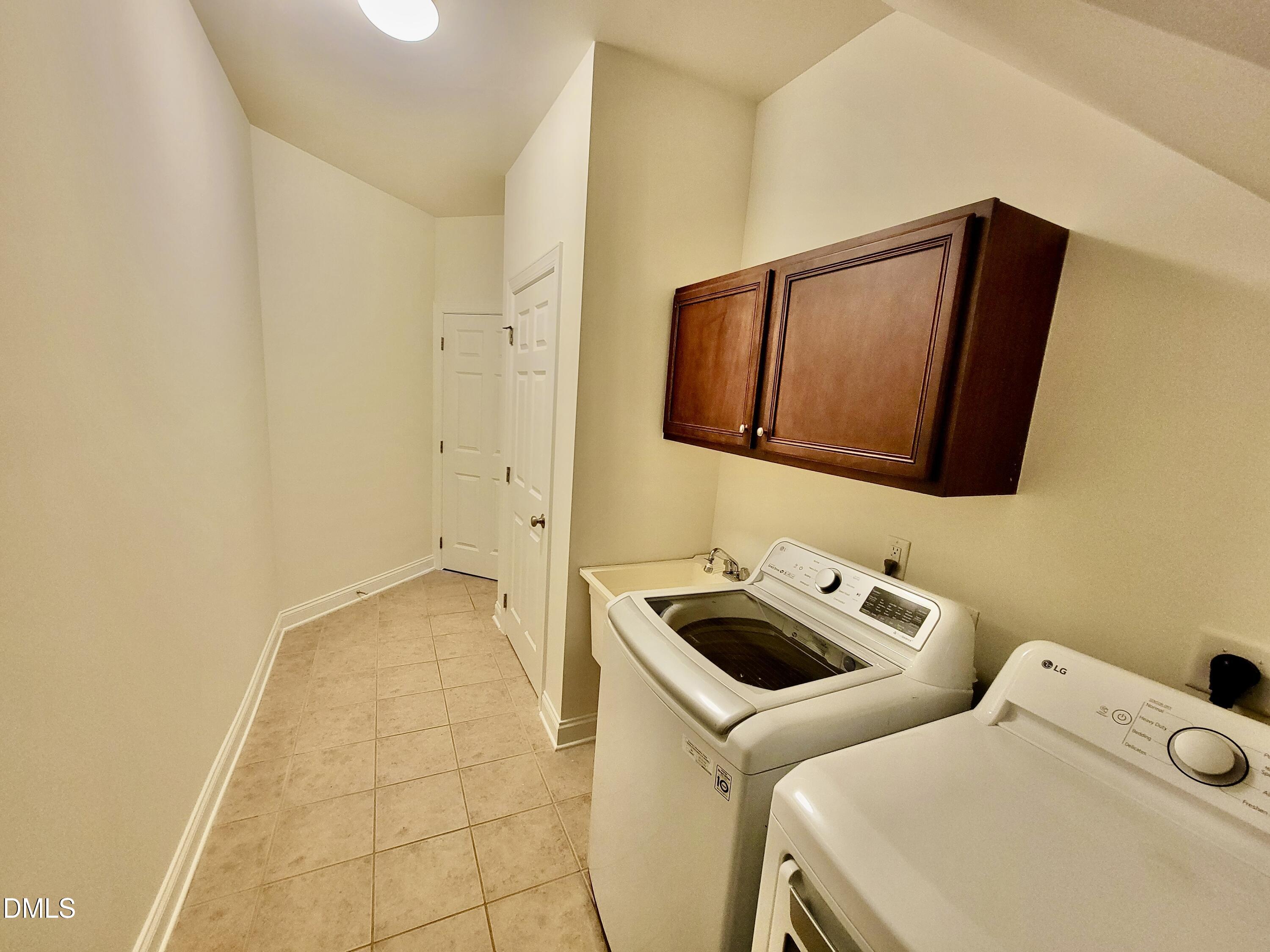 9441 Collingdale Way Raleigh, NC 27617 - Photo 21 of 54 a utility room with dryer and washer