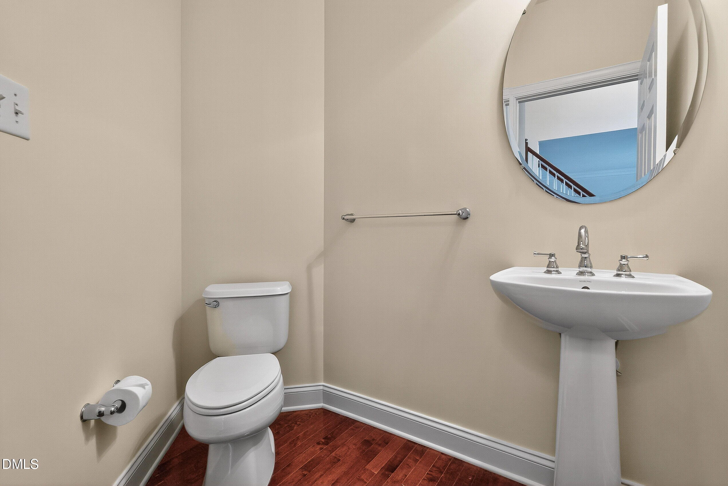 9441 Collingdale Way Raleigh, NC 27617 - Photo 22 of 54 a bathroom with a sink and mirror
